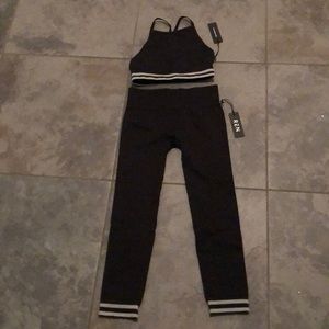 Ren from La collective NWT black workout set